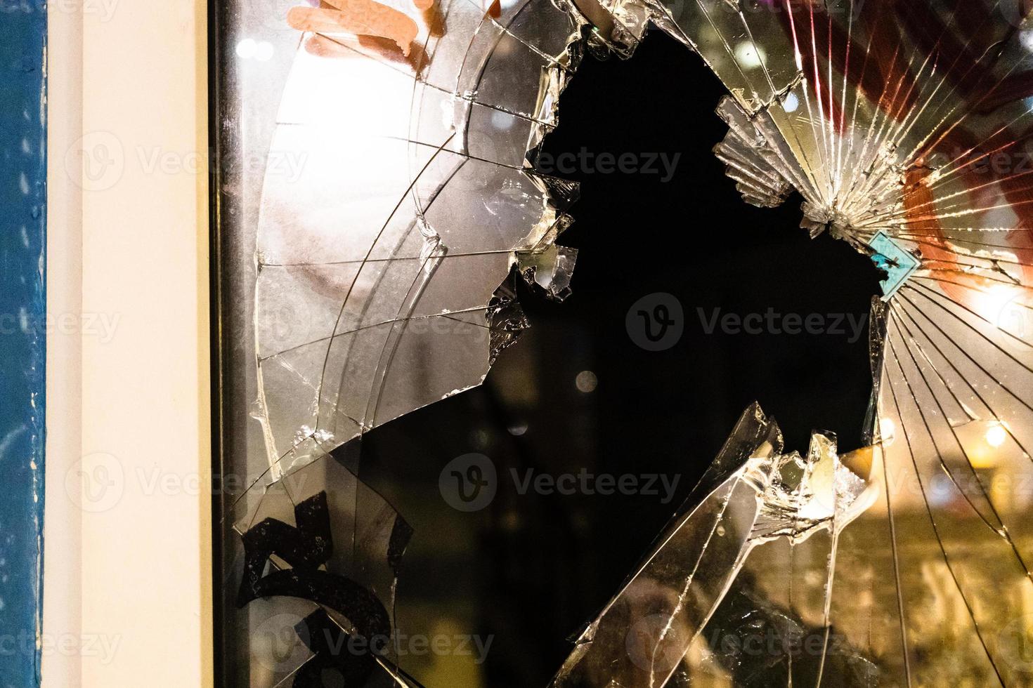 broken window glass in building at night photo