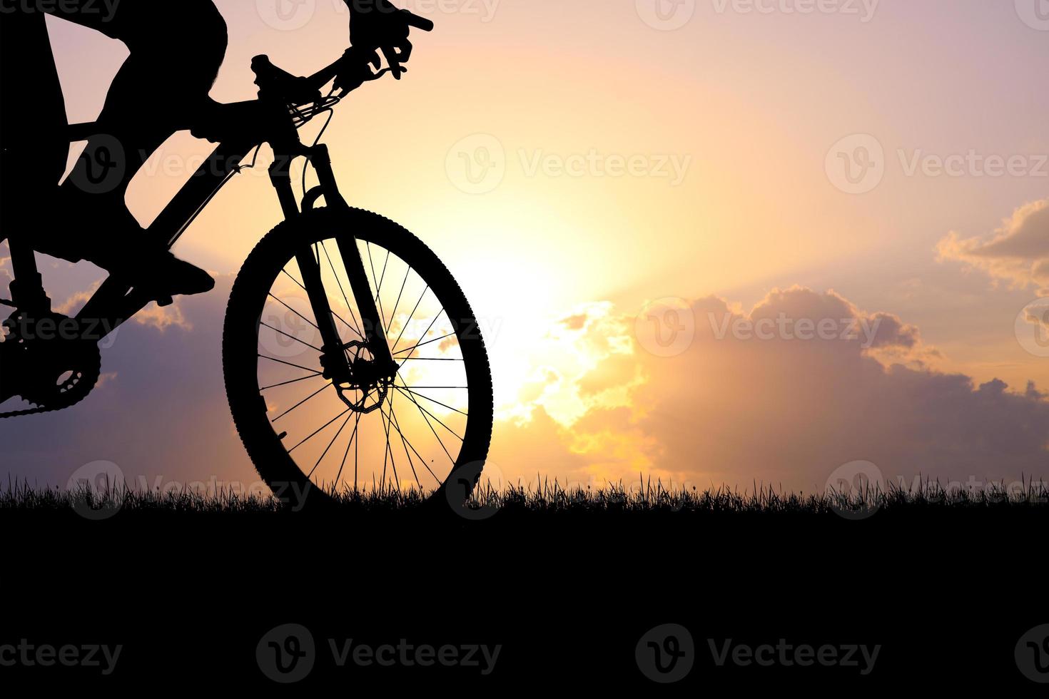 Mountain bike silhouette with beautiful views. photo