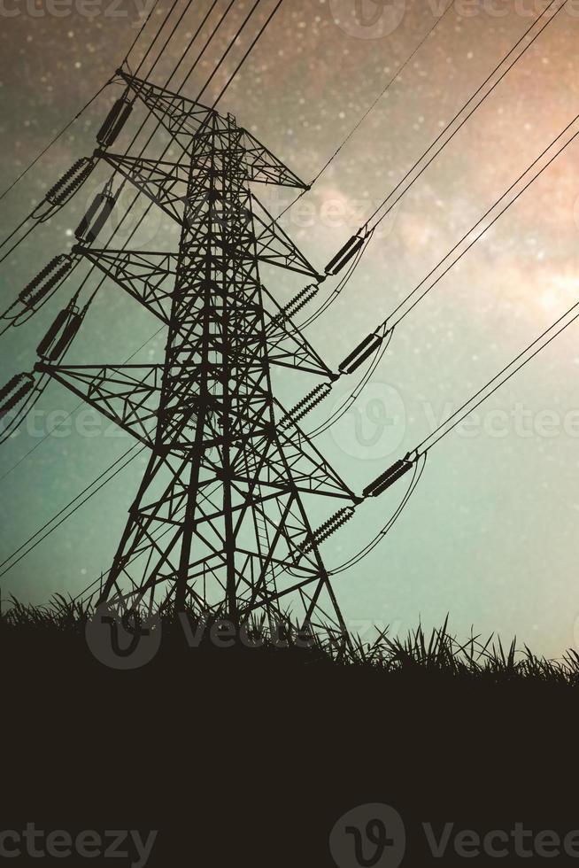 Silhouettes of high voltage poles and power lines It has a complex steel structure, it is strong and durable. photo