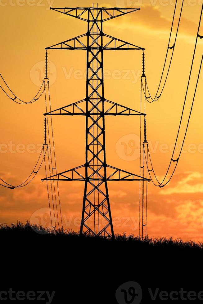 Silhouettes of high voltage poles and power lines It has a complex steel structure, it is strong and durable. photo