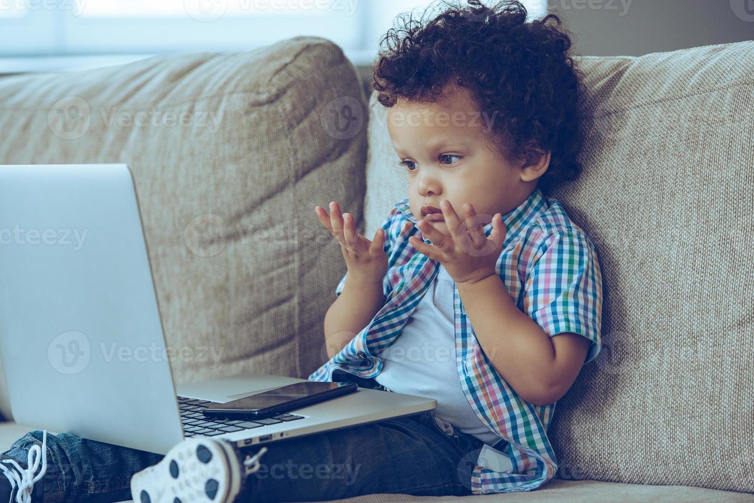 Boy with laptop photo