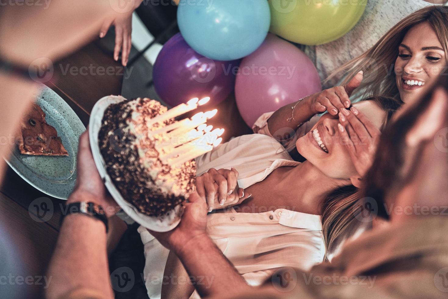 Surprise for her smiling while enjoying a party photo