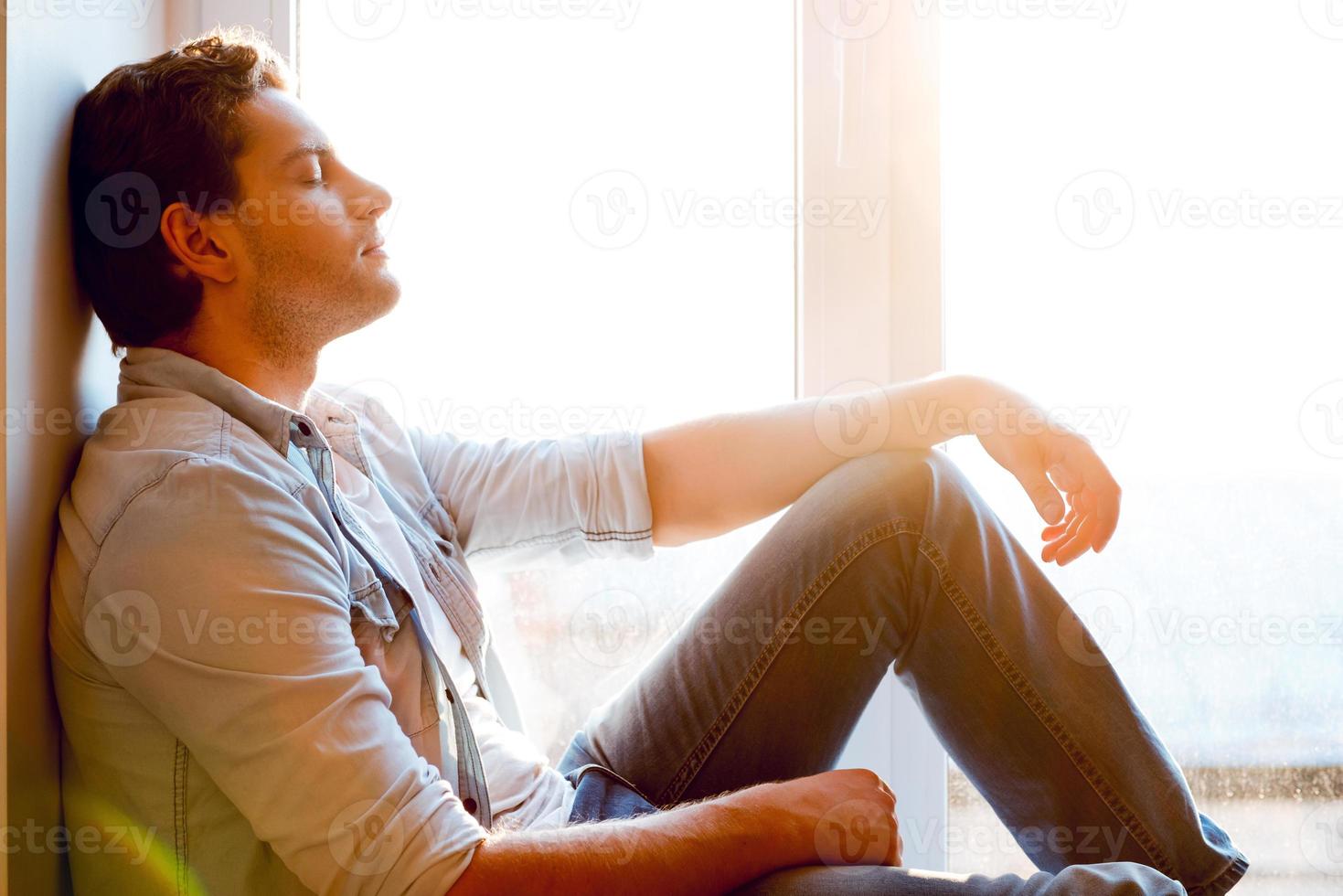 Free Stock Photo of Young Man sitting near window