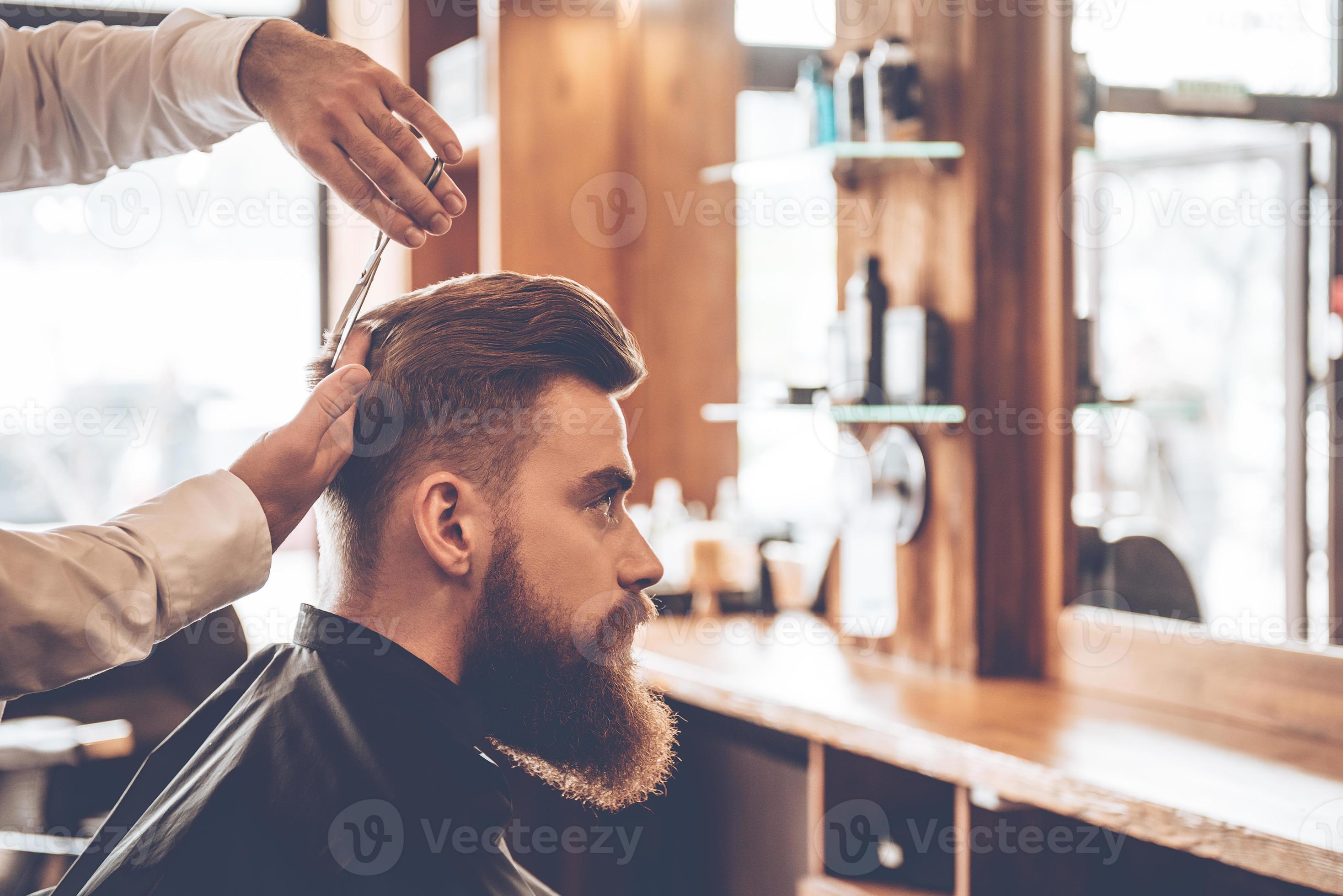 Perfect cut from back to front. Close-up side view of young bearded man getting haircut by hairdresser at barbershop 13523893 Stock Photo at Vecteezy Perfect cut from back to front. Close-up side view of young bearded man getting haircut by hairdresser at barbershop 13523893 Stock Photo at Vecteezy