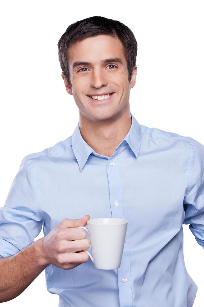 Confident businessman. Portrait of handsome young man in blue shirt looking at camera and keeping arms crossed while standing isolated on white photo