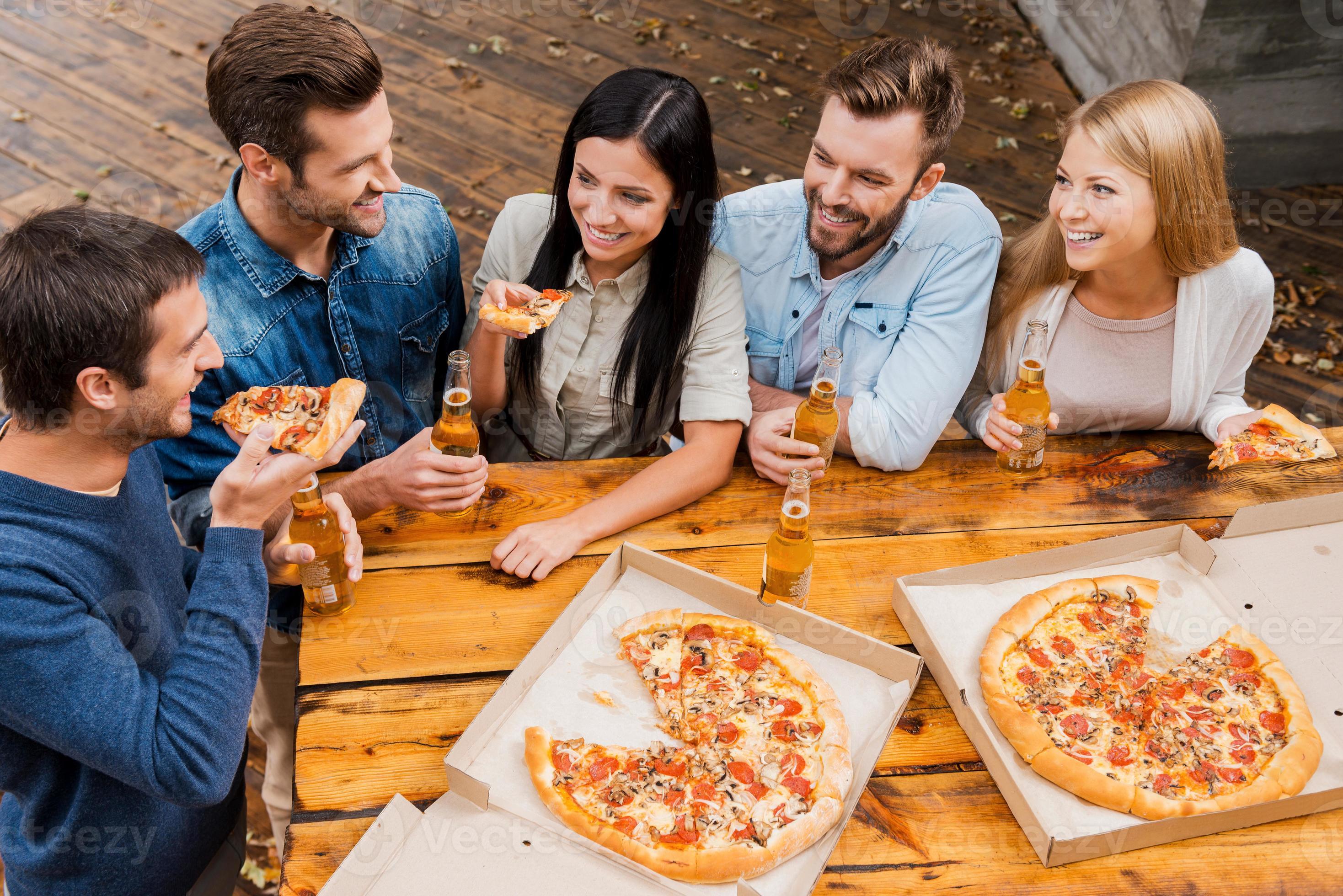 Eating Pizza. Group Of Friends Sharing Pizza Together. People Hands Taking  Slices Of Pepperoni Pizza. Fast Food, Friendship, Leisure, Lifestyle. Stock  Photo