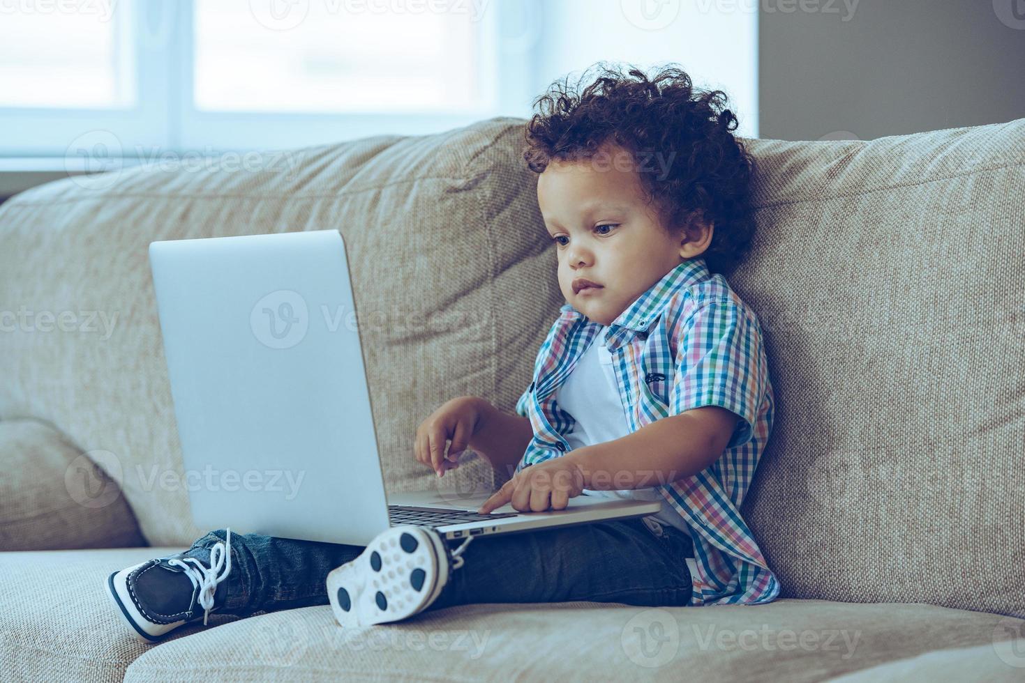 Boy with laptop photo
