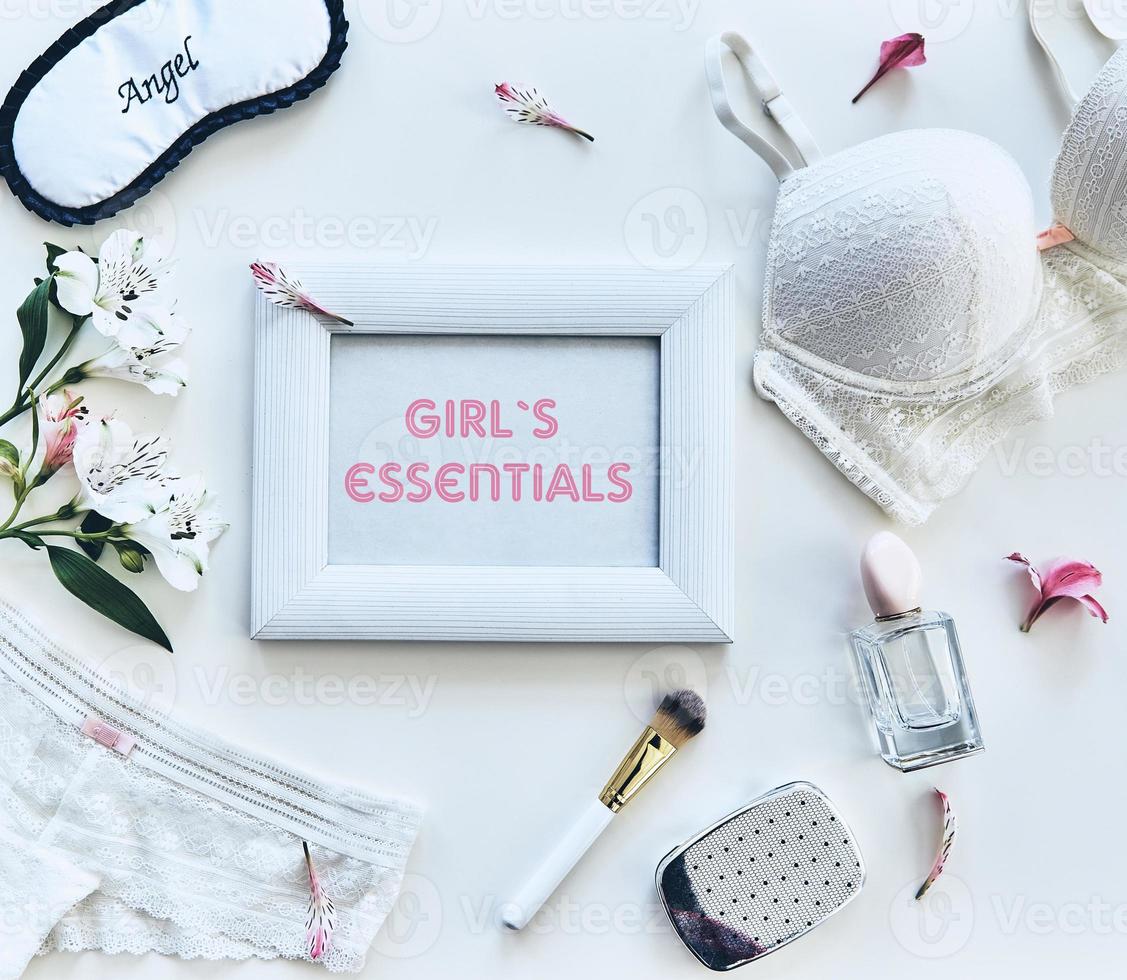 Girls essentials. High angle shot of women stuff lying against white background photo
