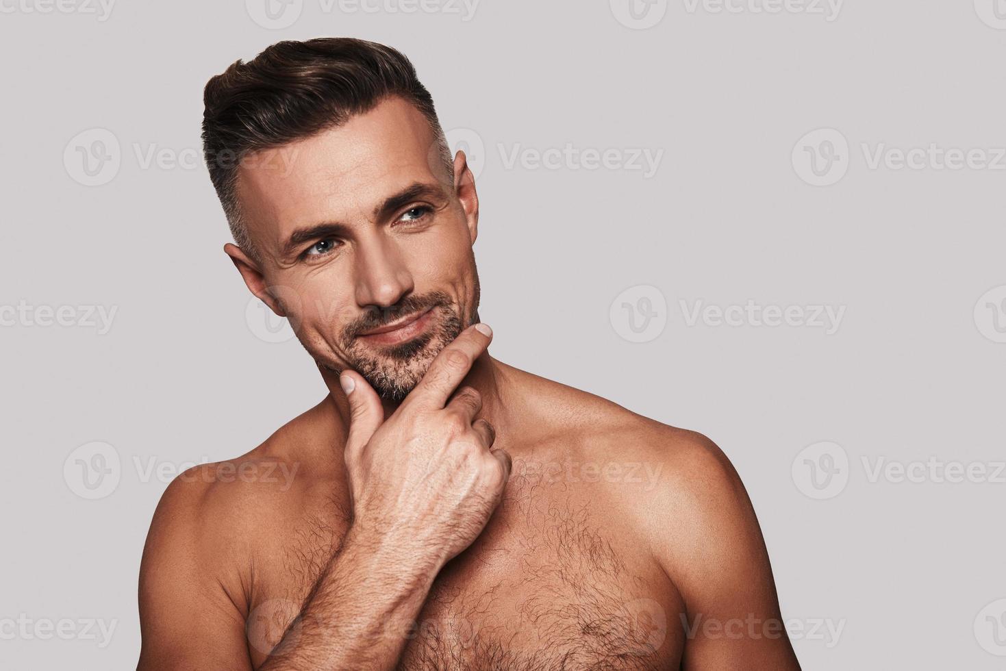 Premium Photo  Take a good look at this face youll miss it later shot of a  handsome young man standing against a grey background