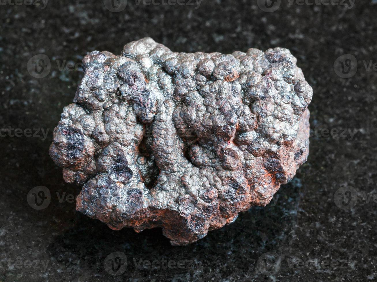 rough Goethite stone on black photo