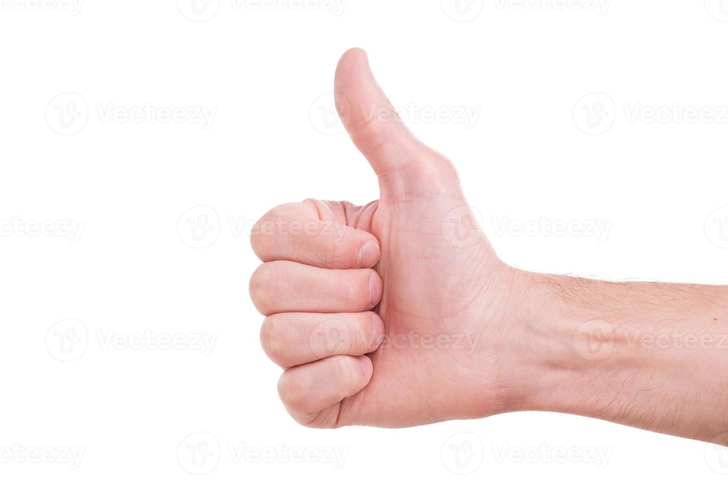 Good Close-up of male hand with thumb up isolated on white photo