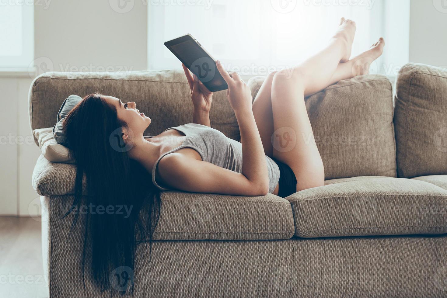Time to wake up Beautiful young woman in black lingerie and tank top  looking at camera while lying in bed 13572801 Stock Photo at Vecteezy
