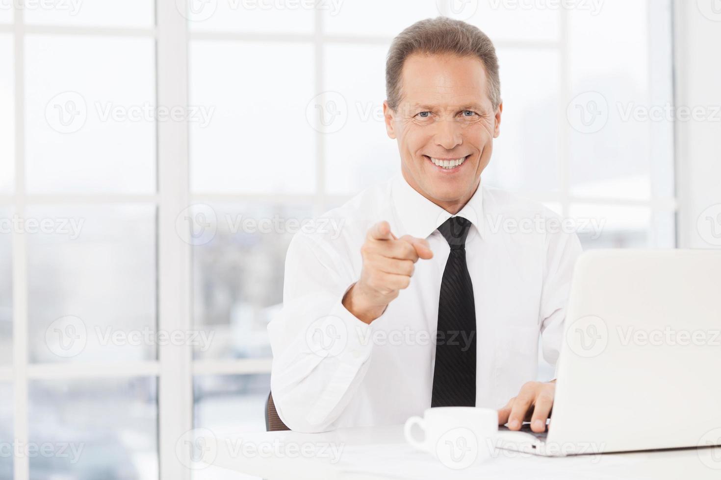 I choose you Cheerful mature man in shirt and tie pointing camera and smiling photo