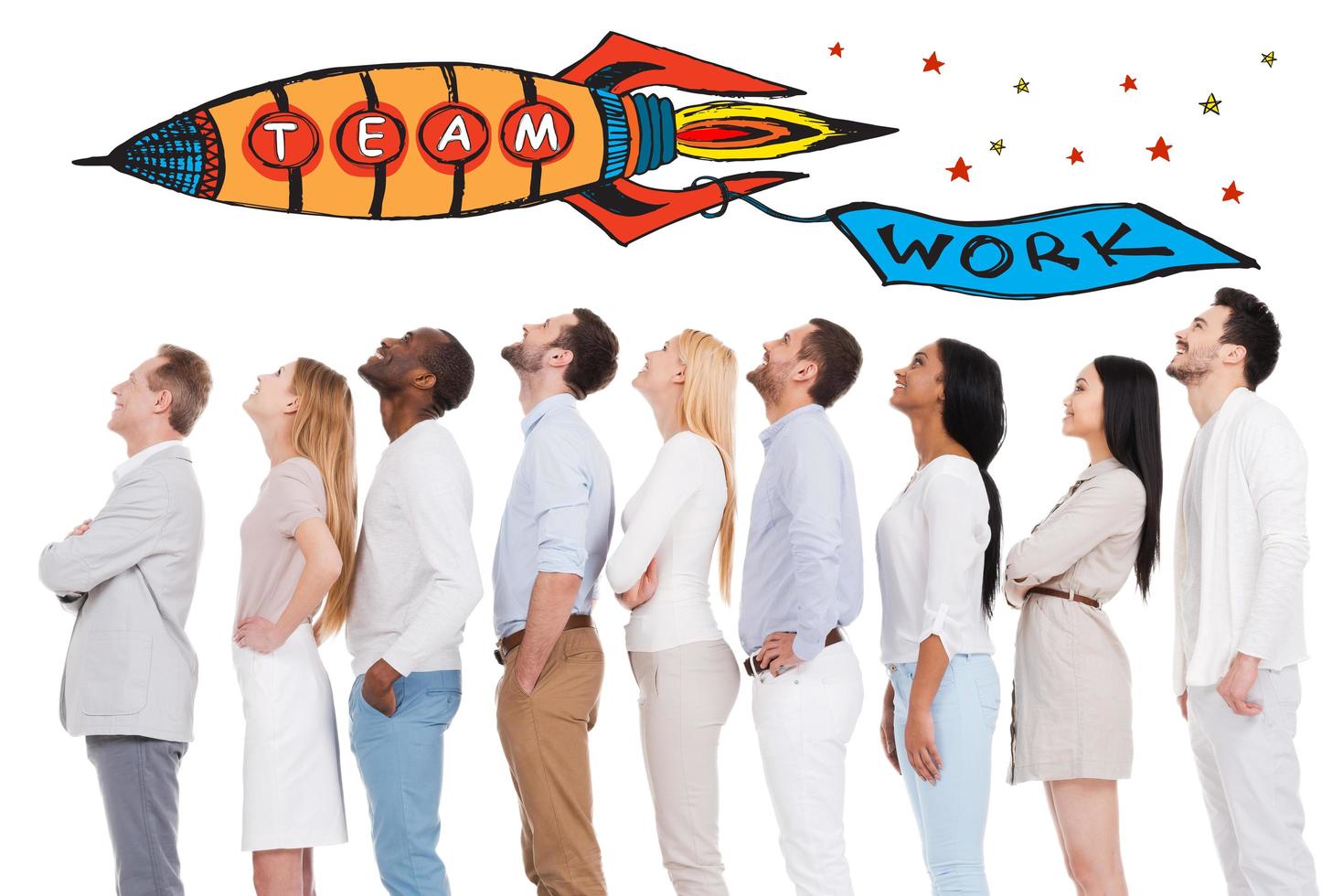 Teamwork is a key to success. Side view of positive diverse group of people in smart casual wear looking up while standing in a row and against white background photo