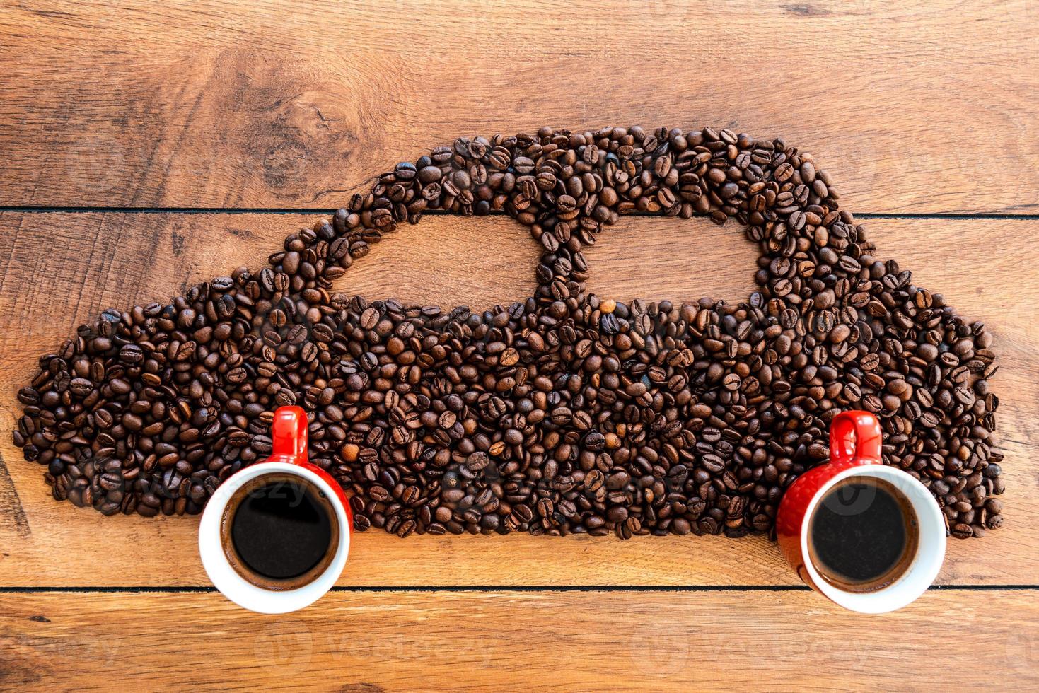 Coffee car. Top view of car made from coffee beans laying on the wooden