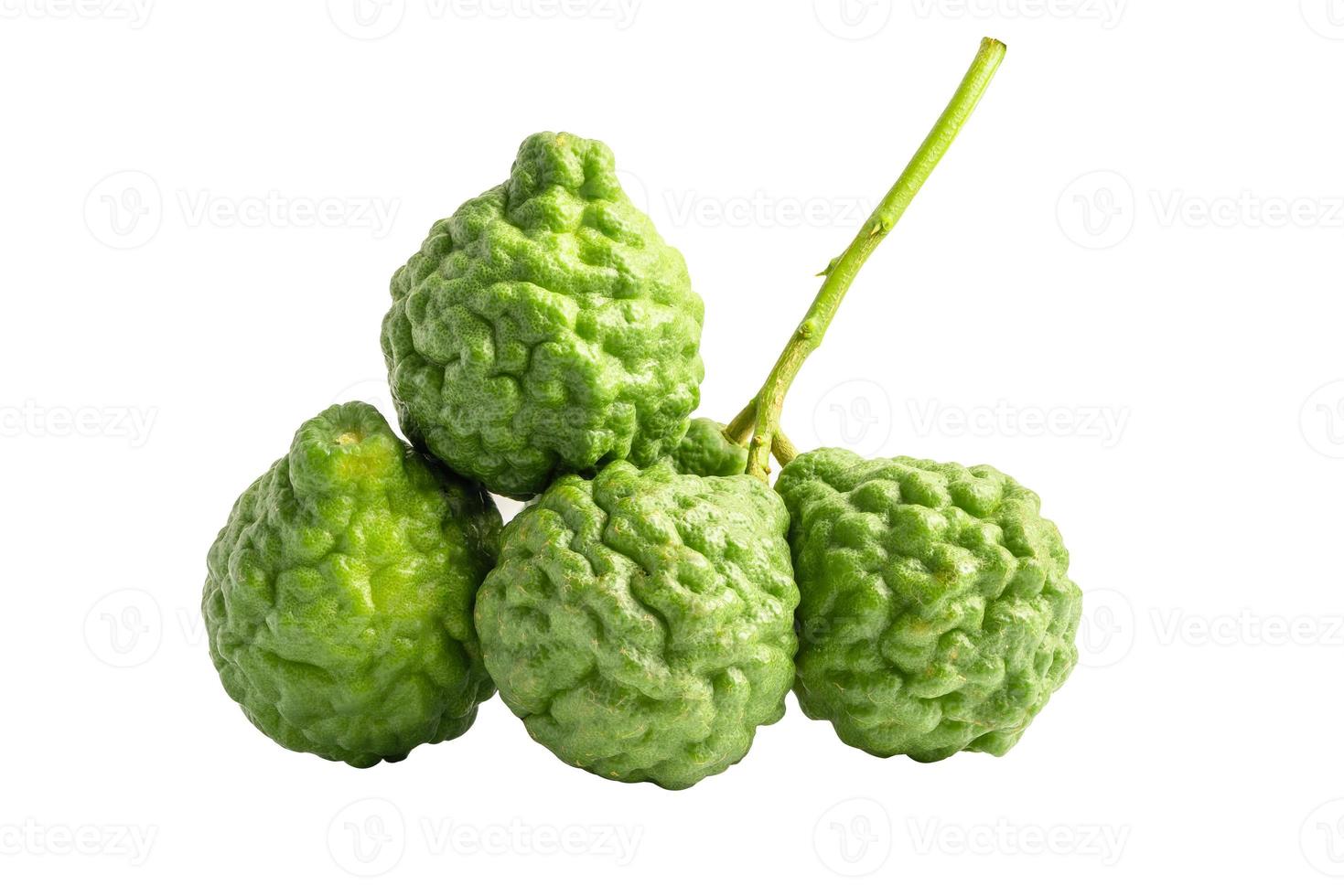 Fresh bergamot or kaffir lime isolate on white background with clipping path, vegetable herb for cook and health. photo