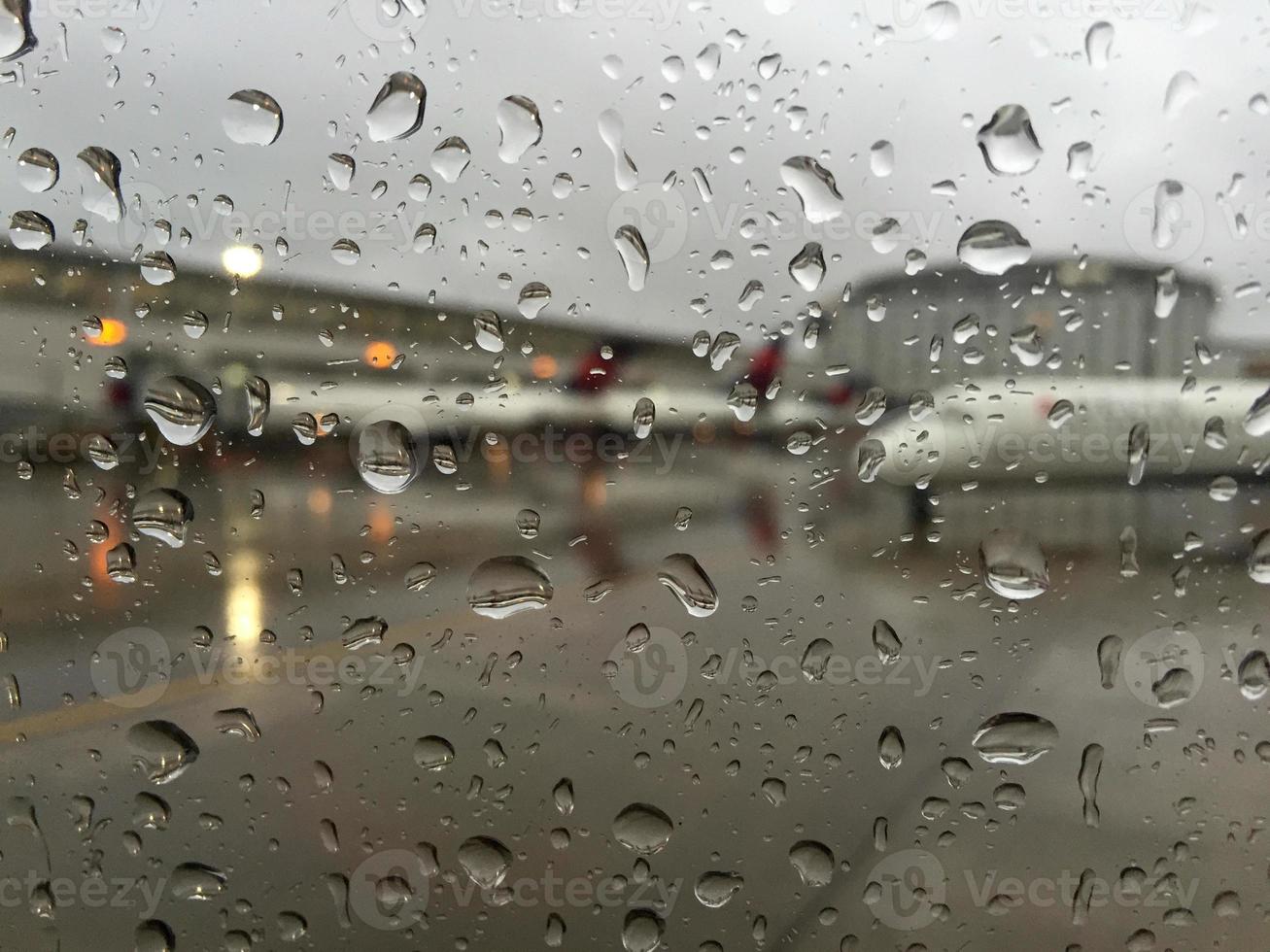 Rain on airplane window photo