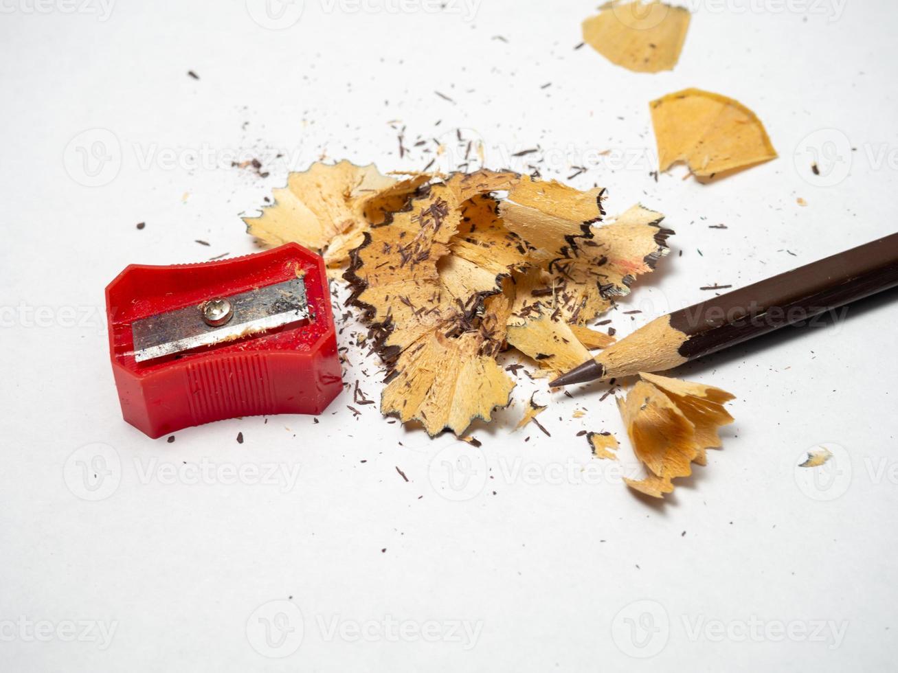 Artist's workshop.   Pencil sharpening. Multicolored pencils. Wood and graphite shavings. The process of preparing for work. Creative mess photo