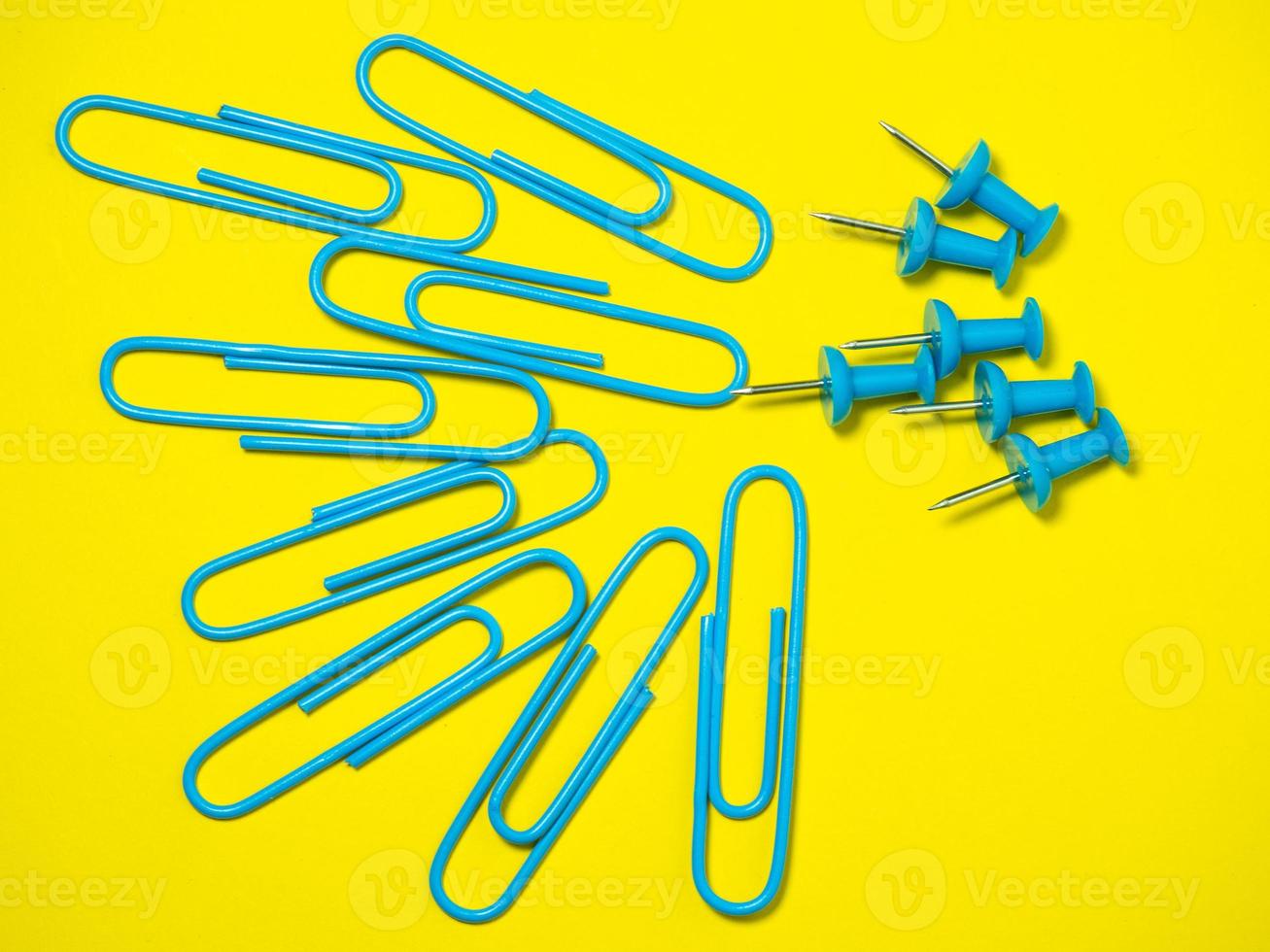 Paper work. Colored paper clips. Work with documents.   Colorful office supplies. photo