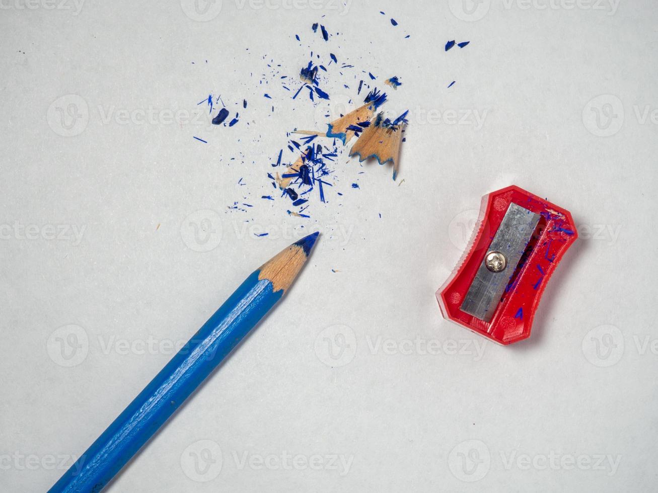 Pencil sharpener . Red sharpener on a white background.  Set for schoolchild photo