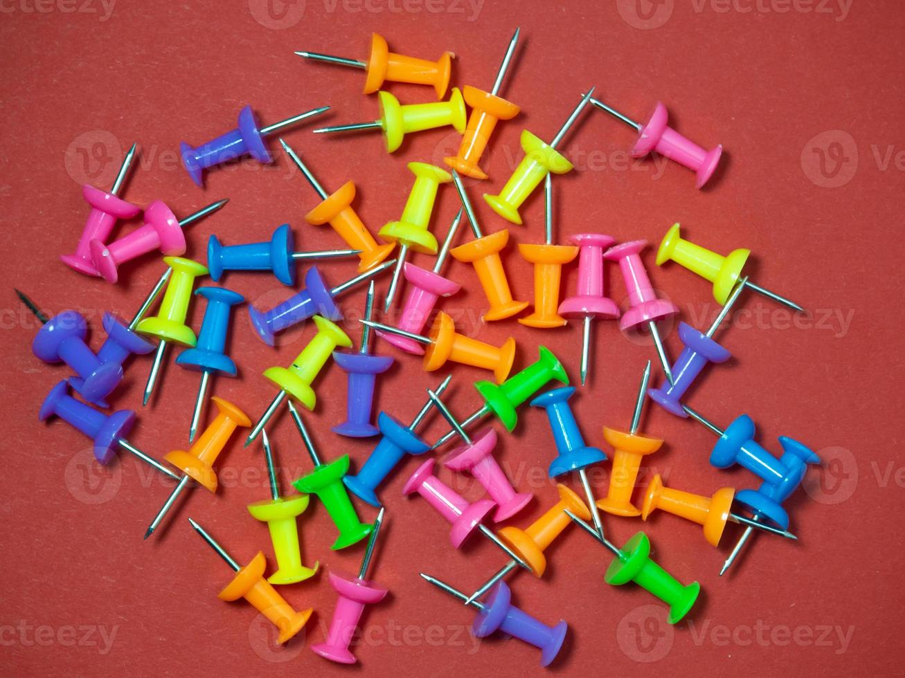 Paper work. Colored paper clips. Colored paper with staples. Work with documents.  Colorful office supplies. photo