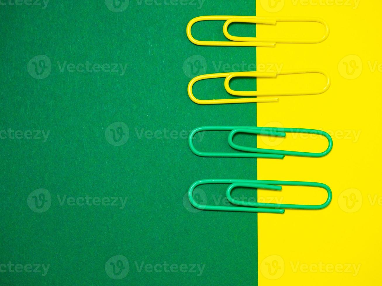 Paper work. Colored paper clips. Colored paper with staples. Work with documents. Office. photo