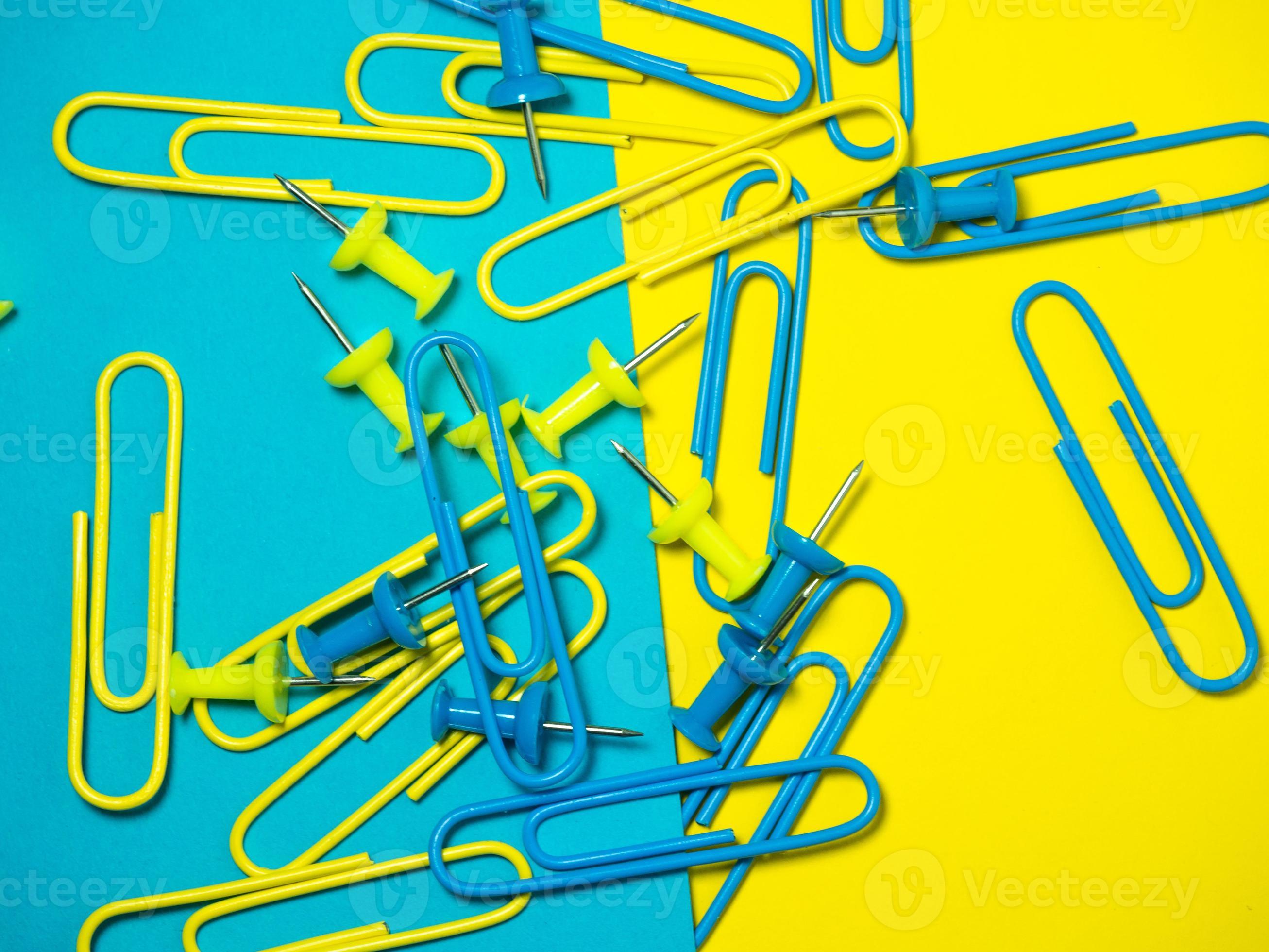 Paper work. Colored paper clips. Work with documents. Office. 13566652