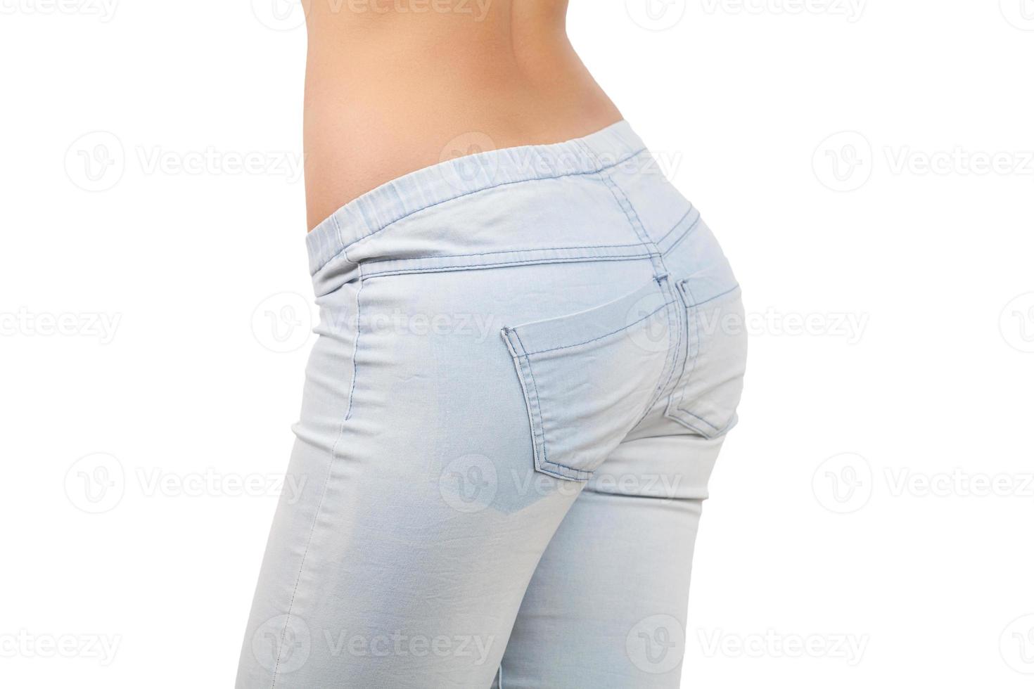 Female buttocks. Close-up of female buttocks in jeans isolated on white background photo