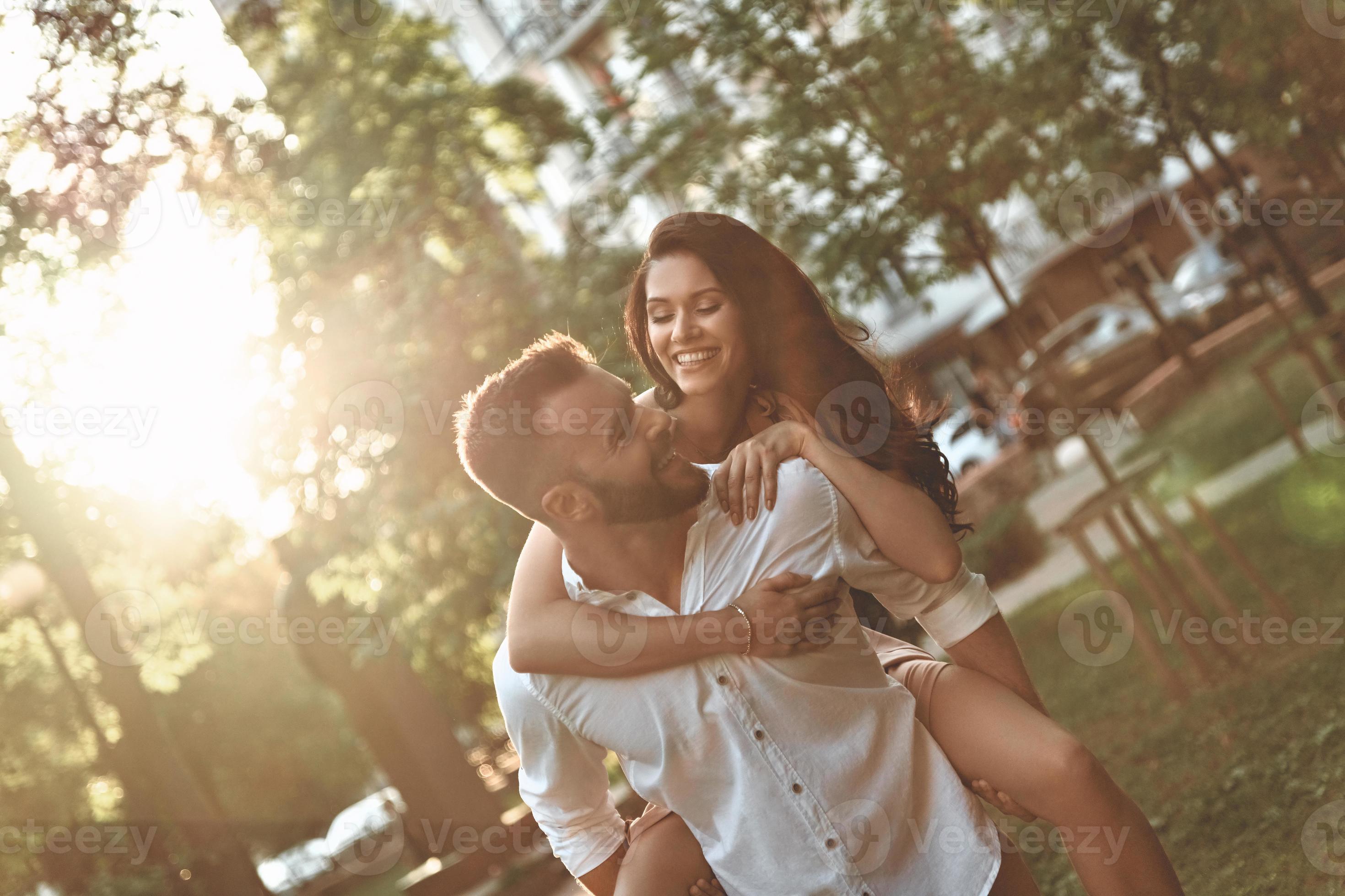 Love makes everything possible. Handsome young man giving his girlfriend a  piggyback ride while spending time together 13571900 Stock Photo at Vecteezy