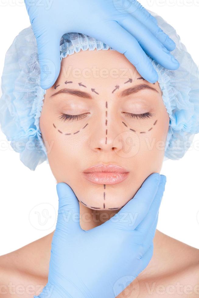Preparation for facial surgery. Attractive young woman in medical