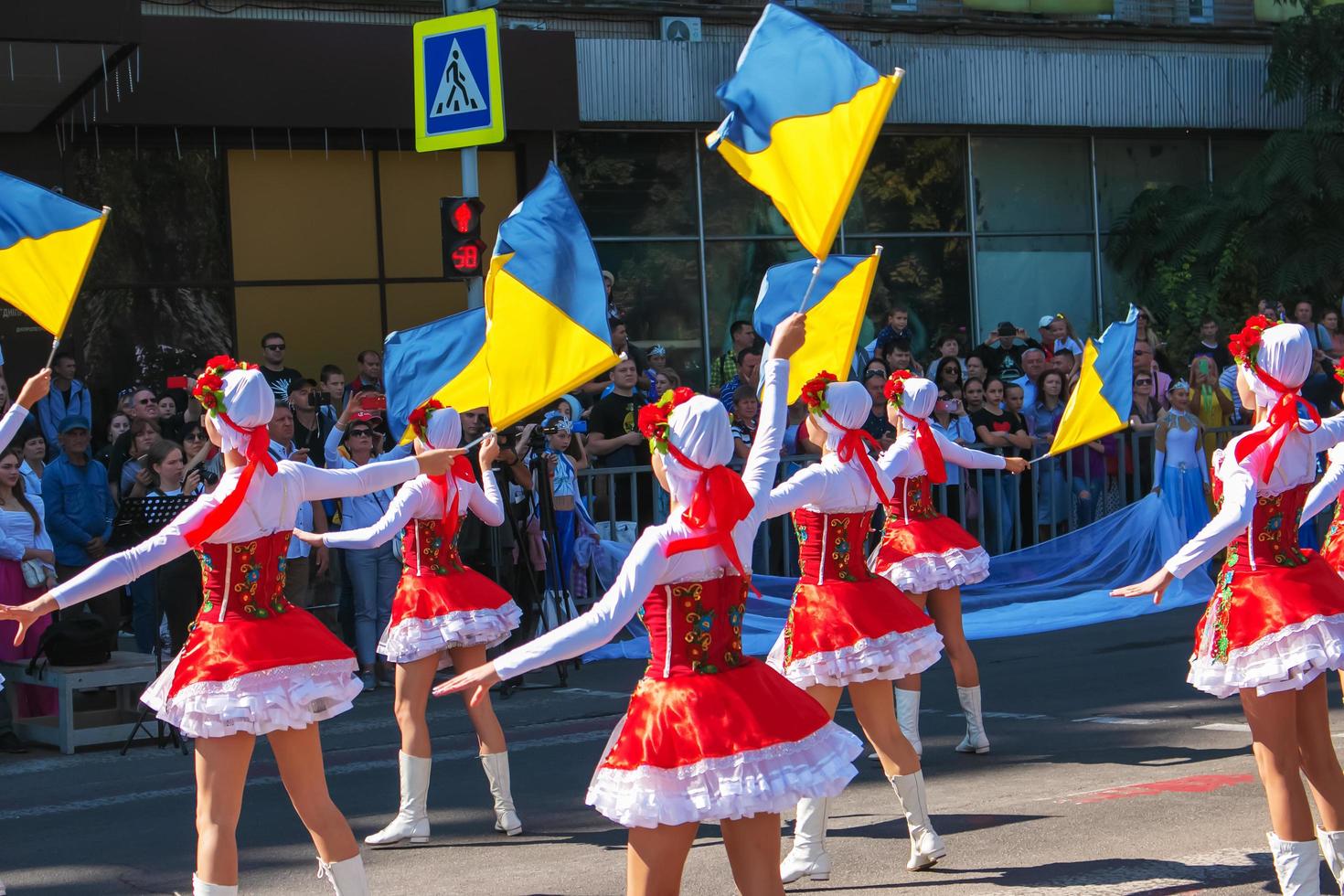 Dnipro, Ukraine - 09.11.2021 Citizens celebrate City Day. Girls dancers with waving flags of Ukraine. photo