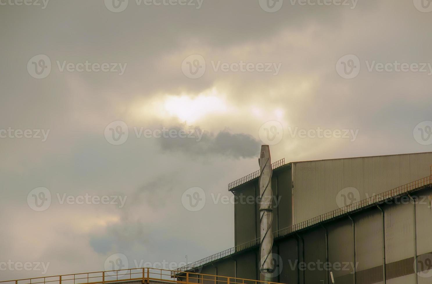 Environmental disaster. Harmful emissions into environment. Smoke and smog. Pollution of atmosphere by factory. photo