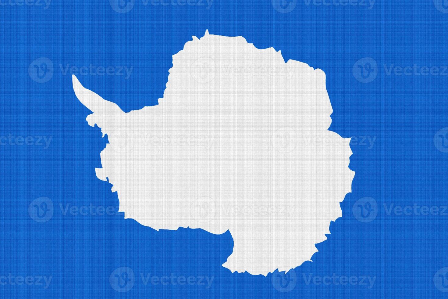 The most widely used flag of Antarctica is the map of the continent. Flag of Antarctica on the texture. Collage. photo