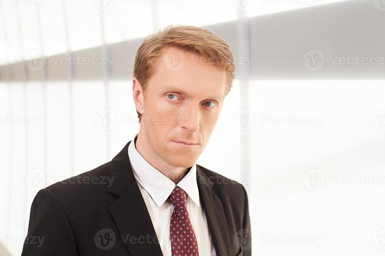 Thoughtful businessman. Thoughtful young man in formalwear looking away photo