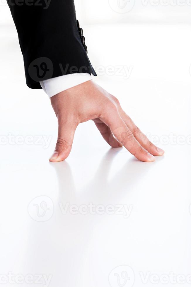 Hand of legacy. Cropped image of human hand leaning at the table photo