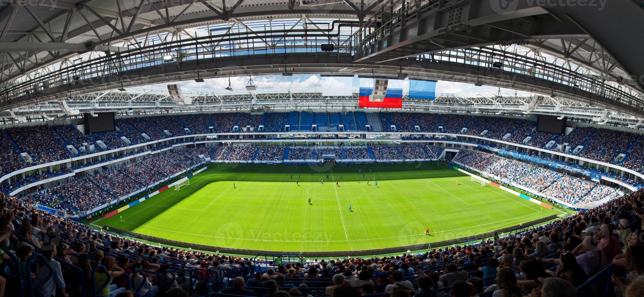 Soccer stadium arena with natural green grass photo