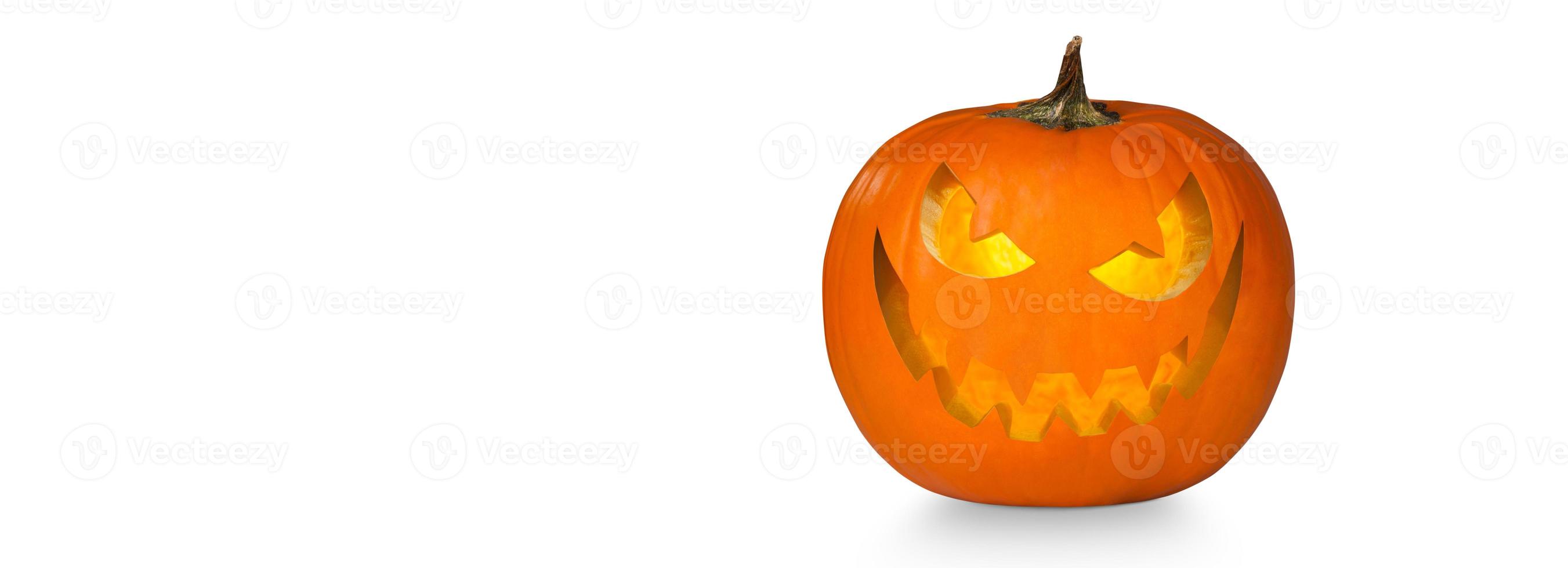 Scary Halloween pumpkin with eyes glowing inside on white background photo