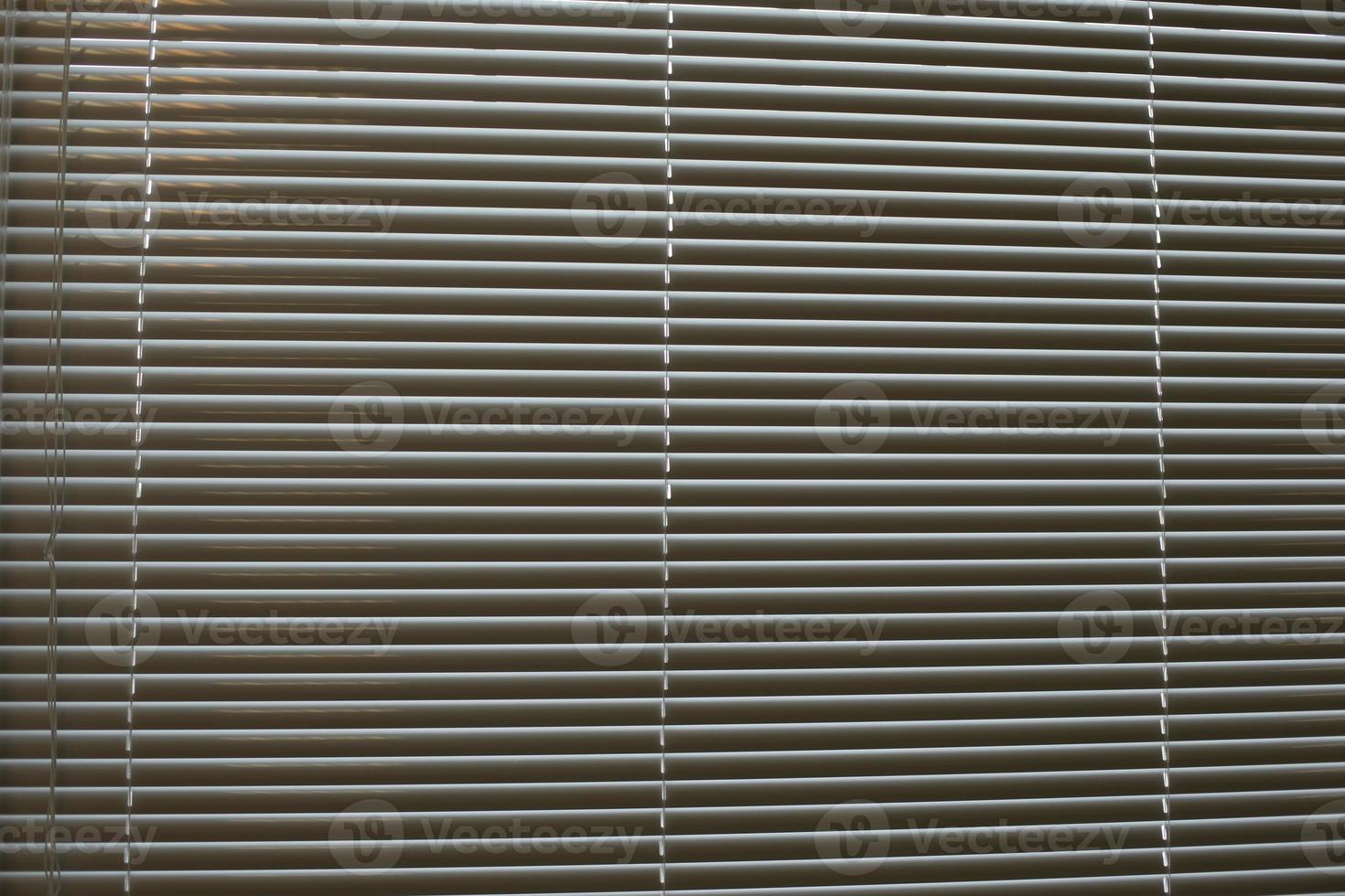 Texture of blinds. Horizontal stripes. Light through blinds. photo