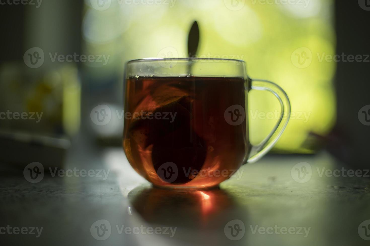 Tea on table in morning. Glass of tea. Drink for breakfast. photo