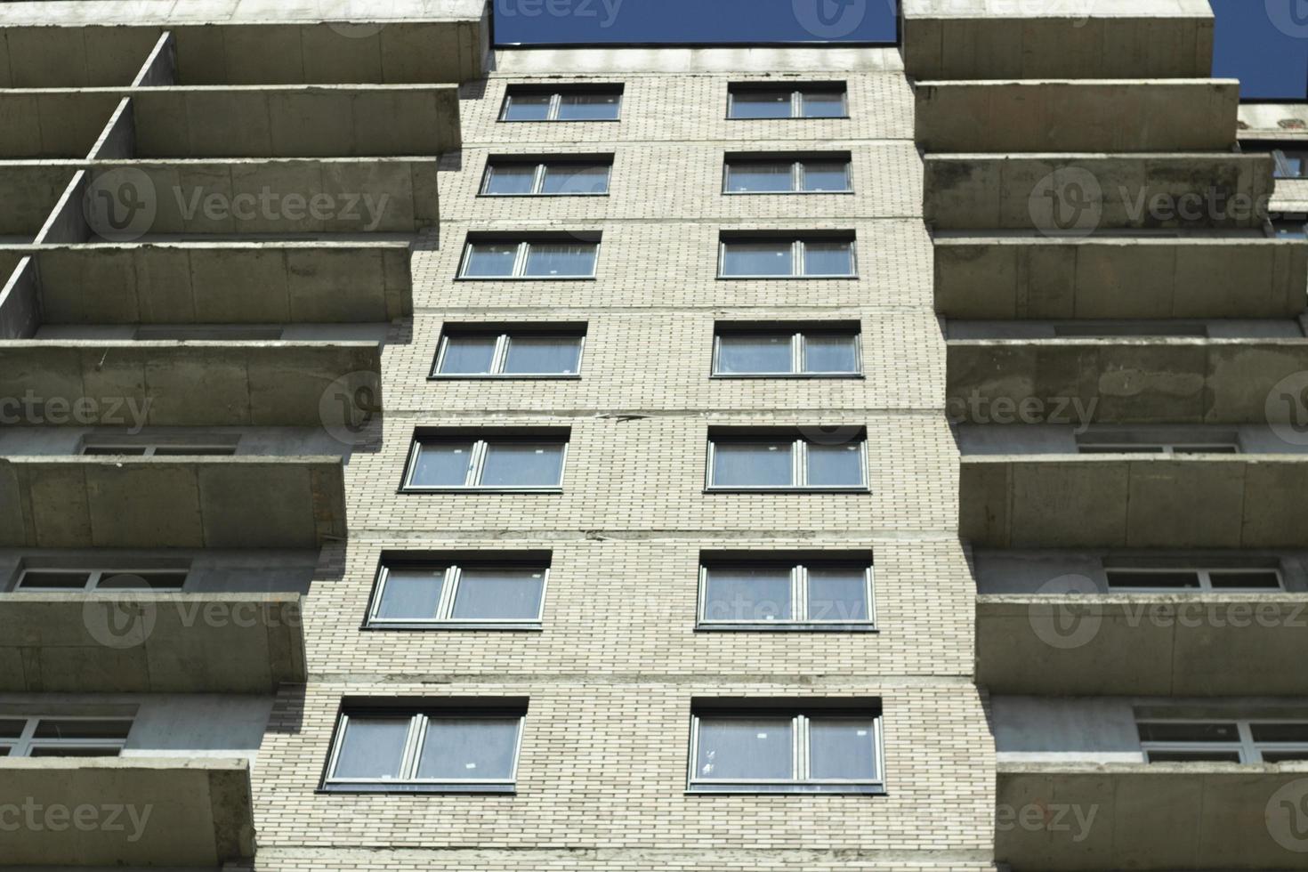 Windows in new house. Construction of residential complex. Building is made of concrete. Architecture details. photo