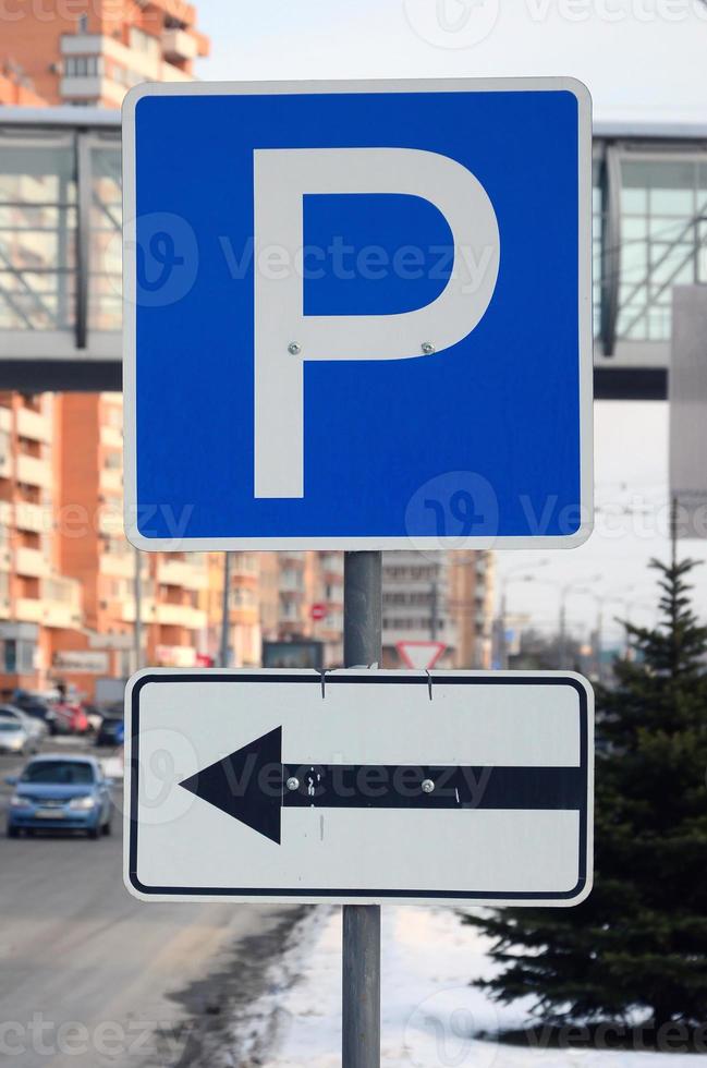 Parking left. Traffic sign with the letter P and the arrows to the left photo