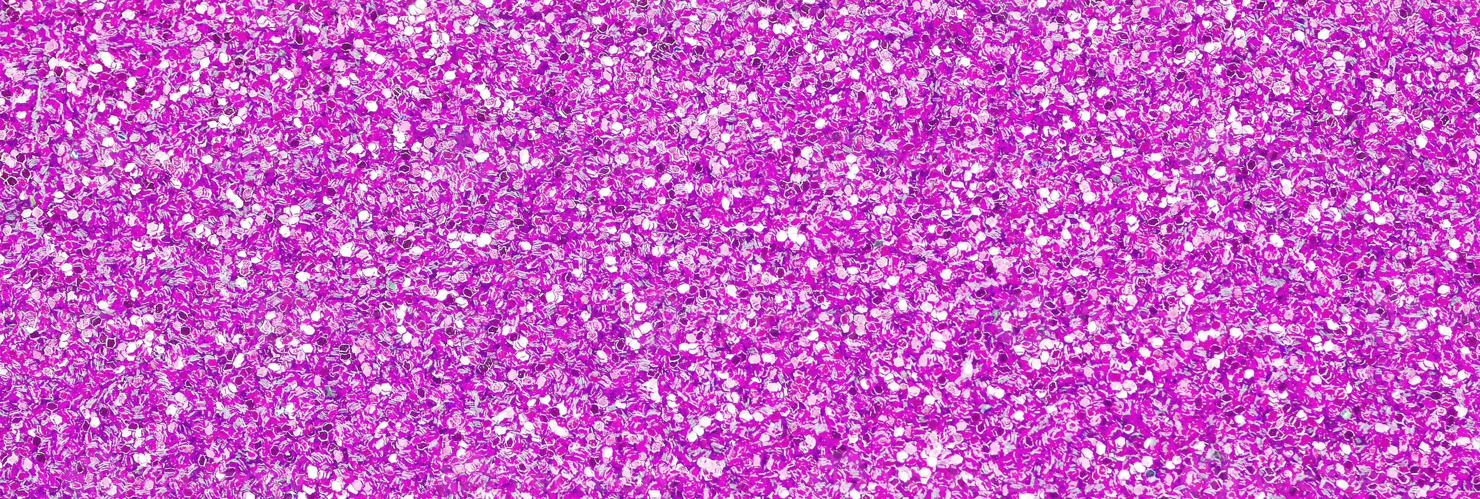 Pink decorative sequins. Background image with shiny bokeh lights from small elements photo