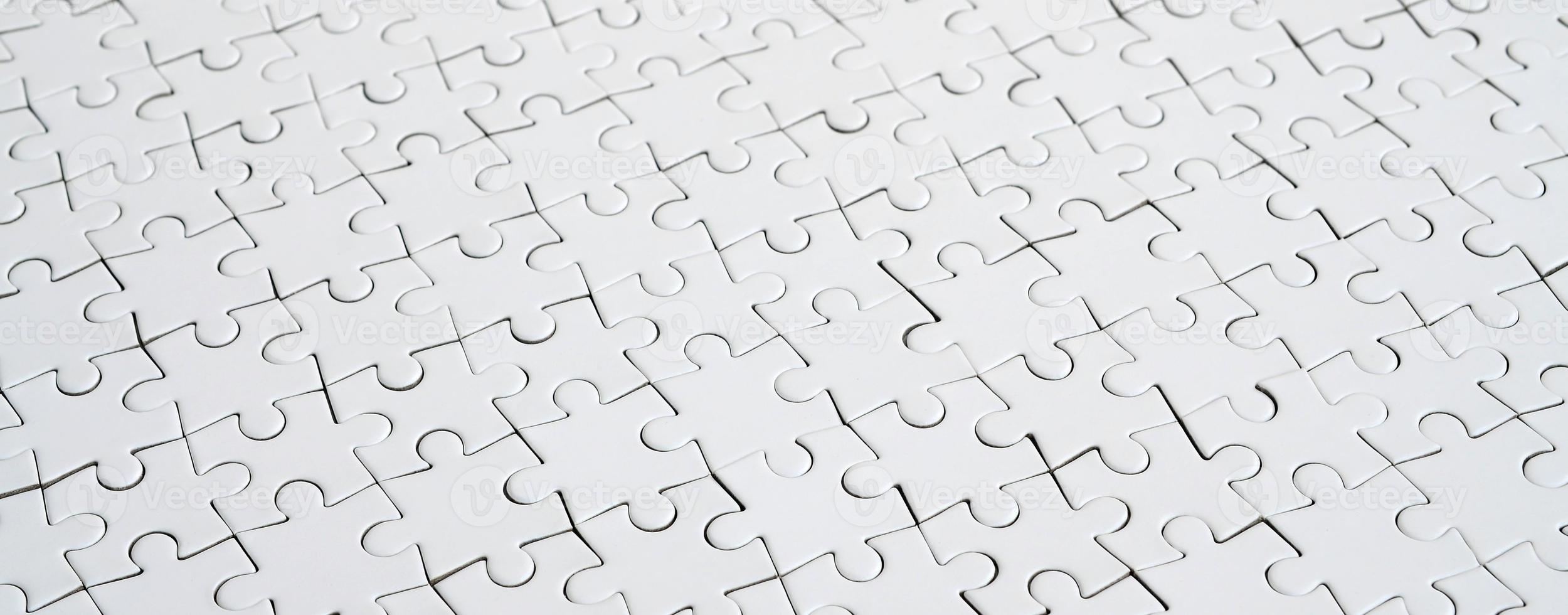 Close up of a white jigsaw puzzle in assembled state in perspective