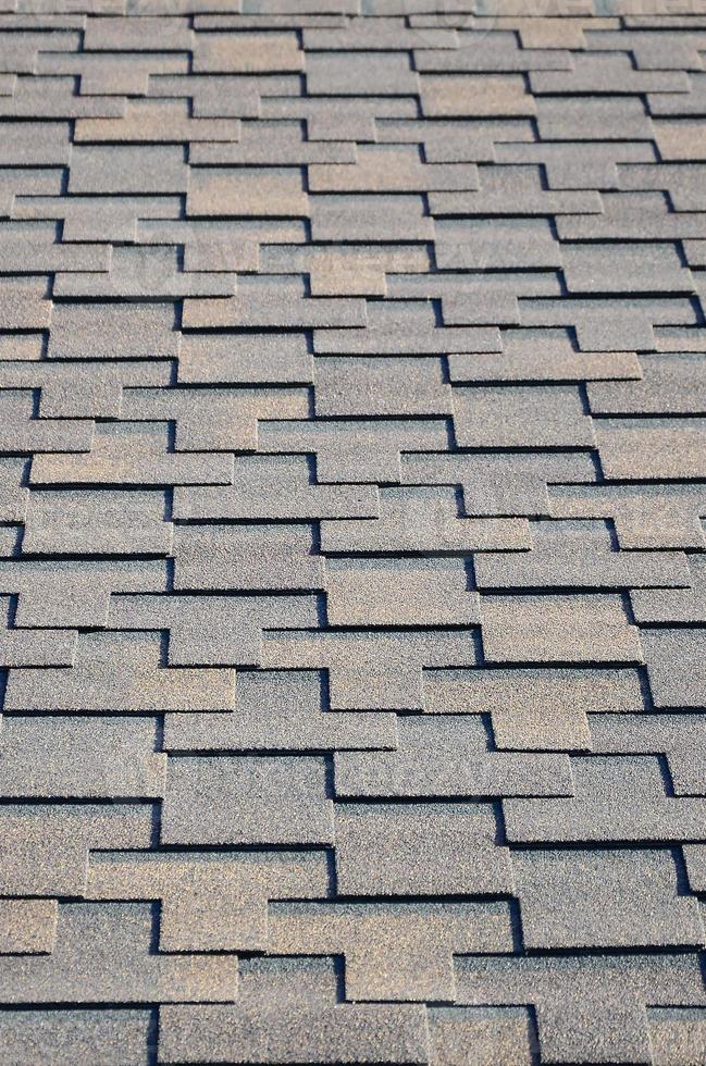 Modern roofing and decoration of chimneys. Flexible bitumen or slate shingles photo