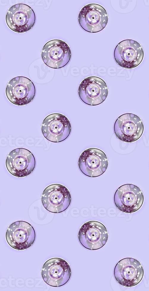Many used spray cans for graffiti drawing lies on a pastel colored backgroung. Street art painting concept. Minimal flat lay pattern. Top view photo