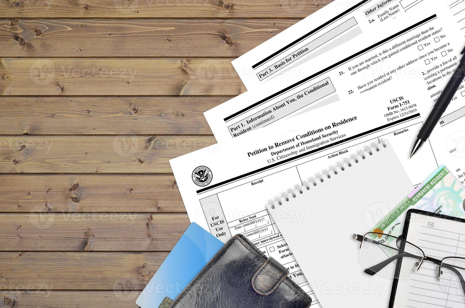 USCIS form I-751 Petition to remove conditions on residence lies on flat lay office table and ready to fill. U.S. Citizenship and Immigration services paperwork concept photo