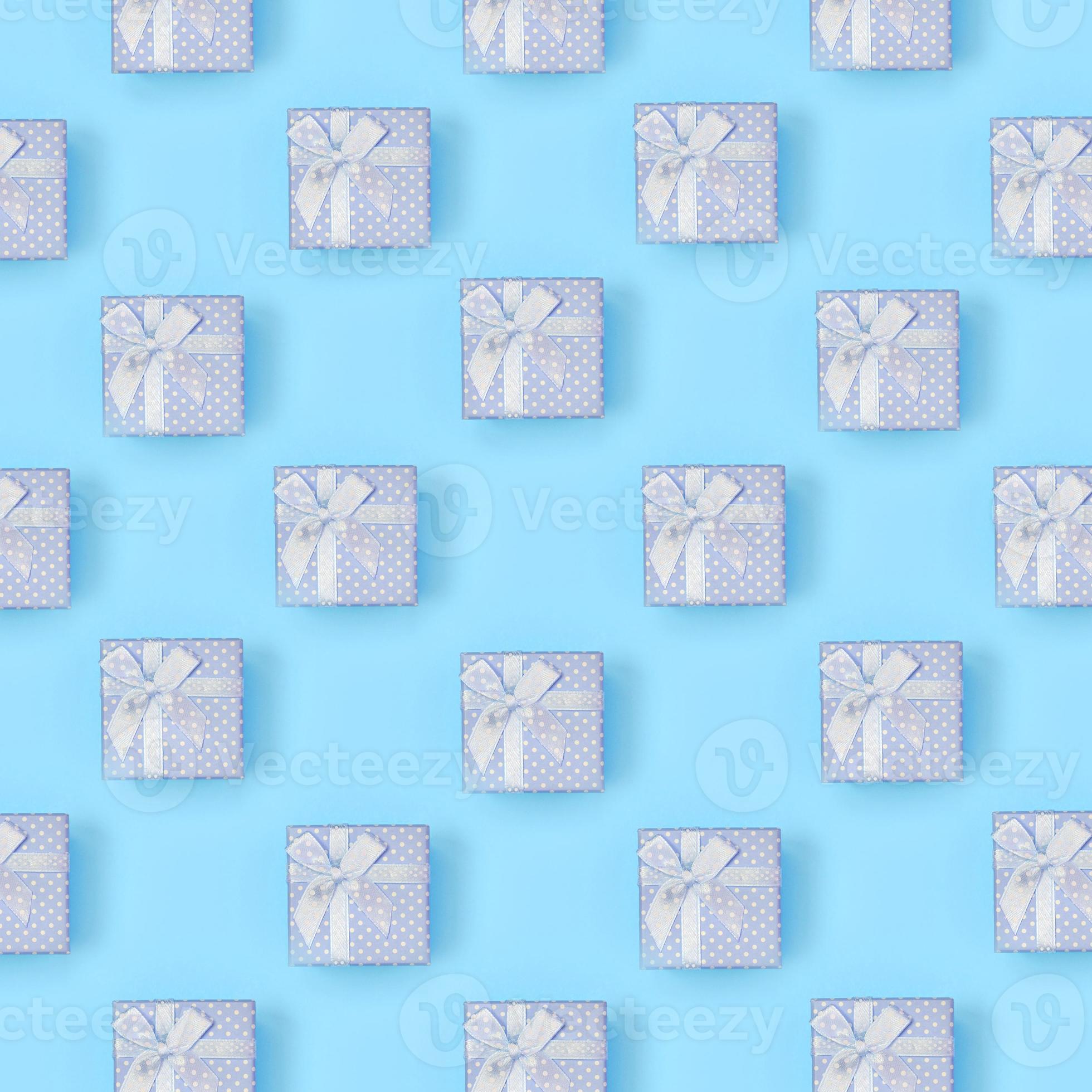 A lot of blue gift boxes lies on texture background of fashion pastel