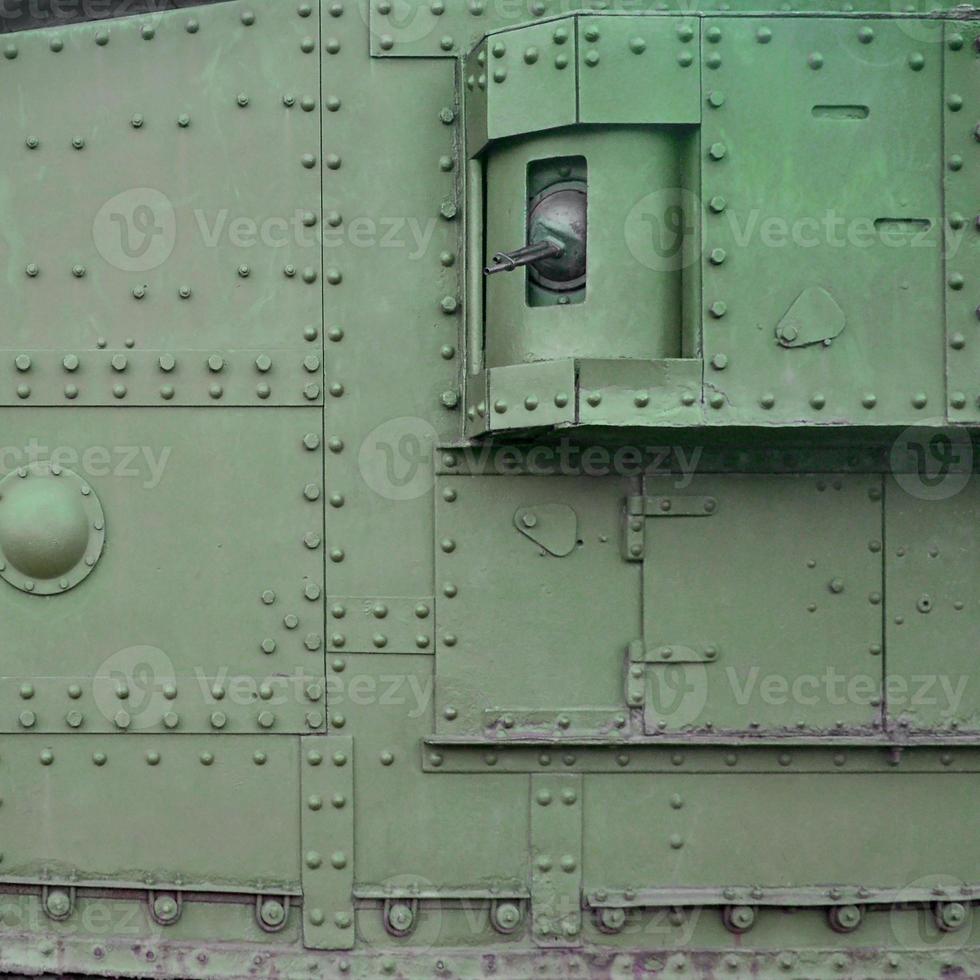 Abstract green industrial metal textured background with rivets and bolts photo