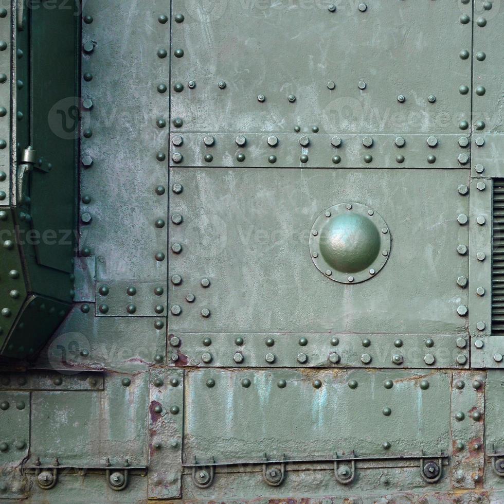 Abstract green industrial metal textured background with rivets and bolts photo