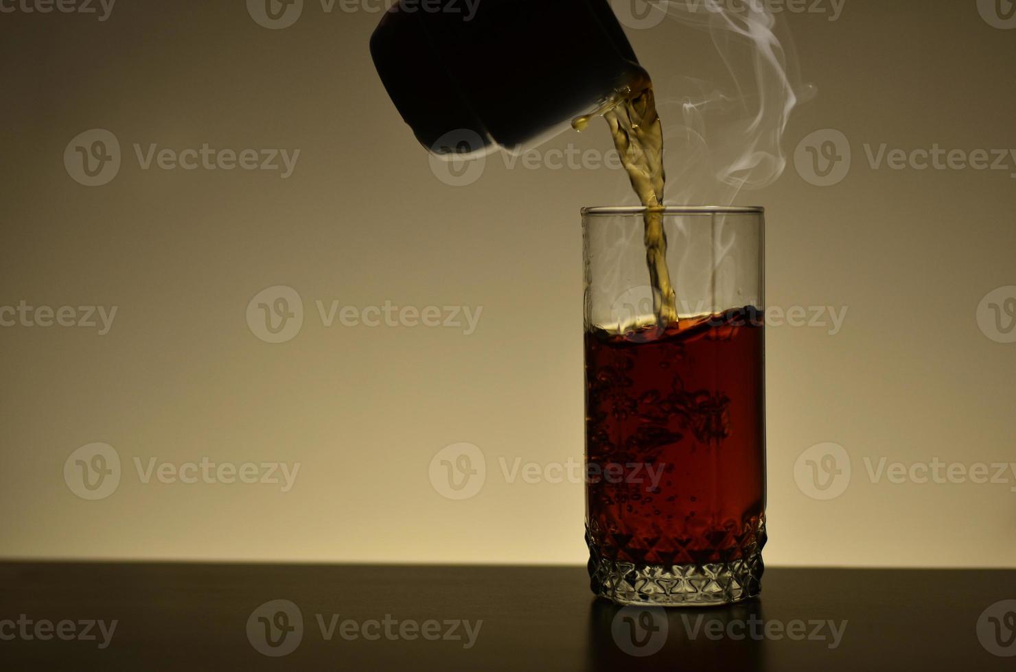 Pouring cup of tea photo